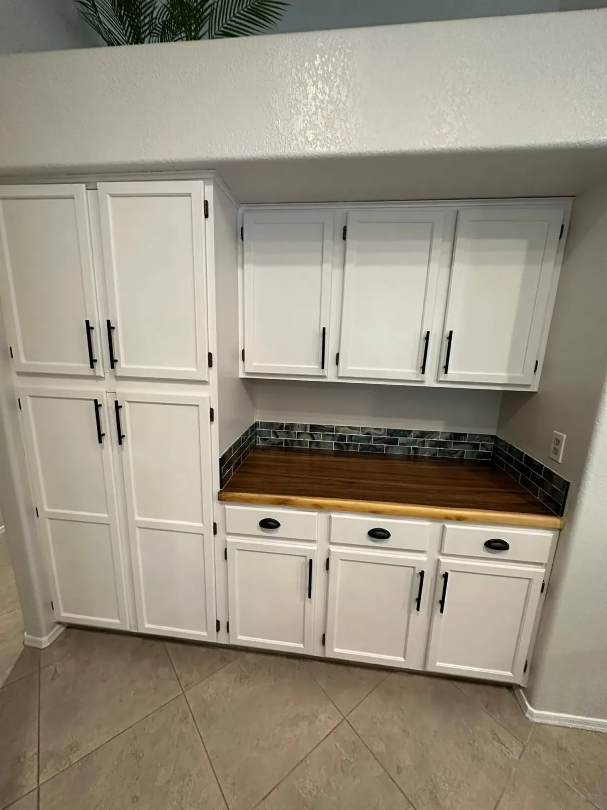 White custom cabinet storage wall by Ramos Cabinetry and Construction in Gilbert, AZ