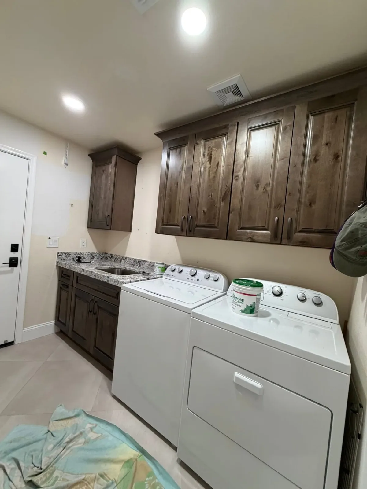 Laundry room cabinet storage and utility room cabinetry by Ramos Cabinetry and Construction in Mesa, AZ