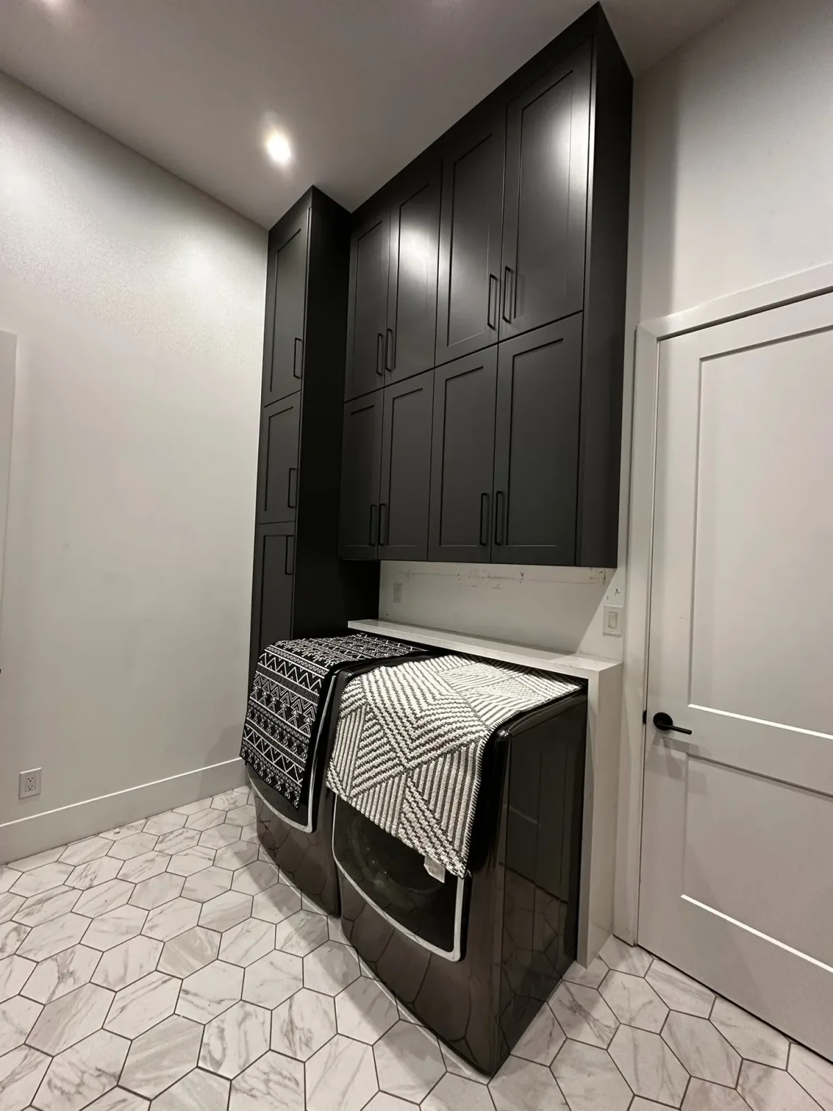 Laundry room cabinetry and storage by Ramos Cabinetry and Construction in Phoenix, AZ